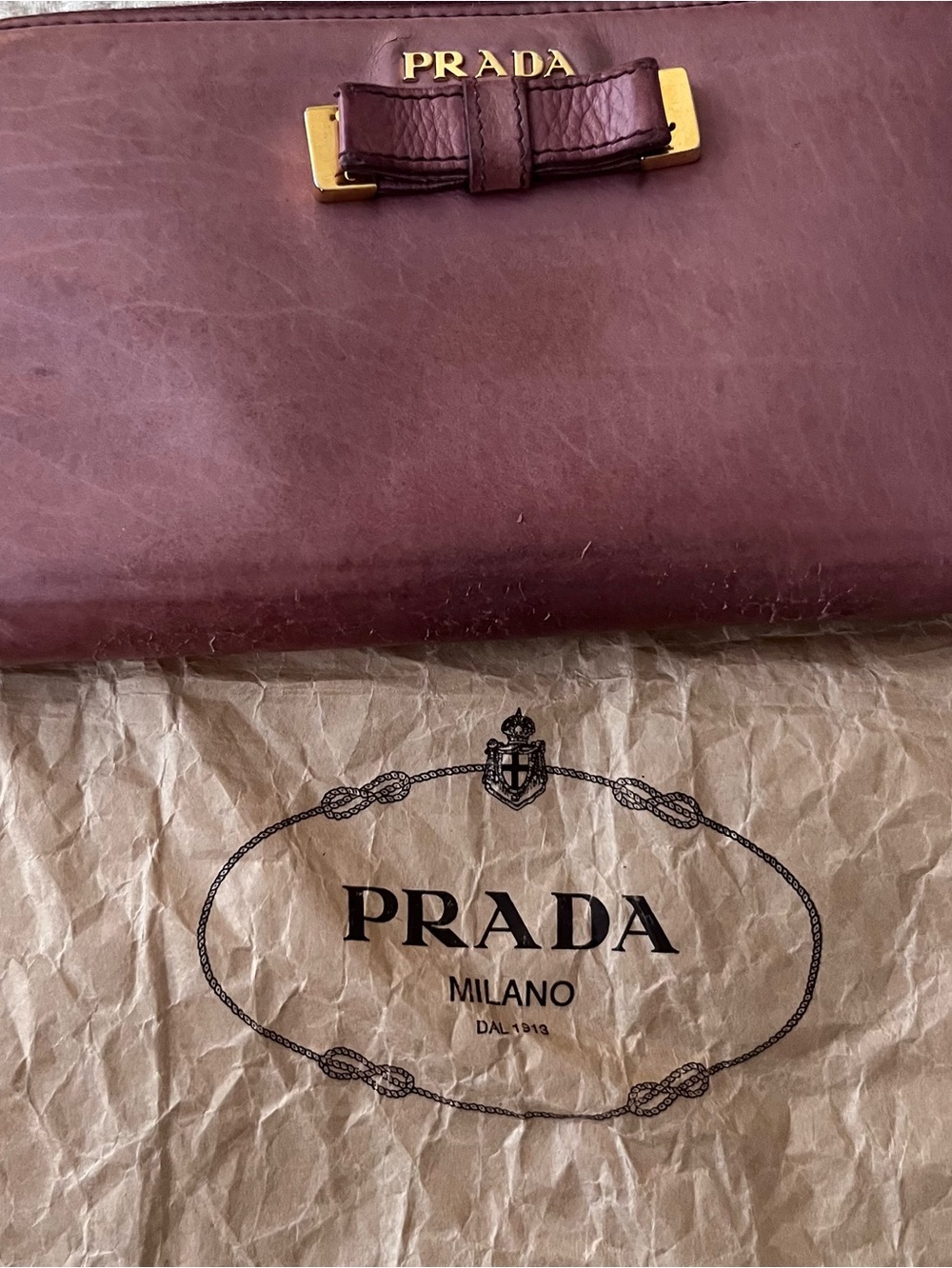 Prada wallet pre loved a lot of life left perfect outside wear on outside leathe